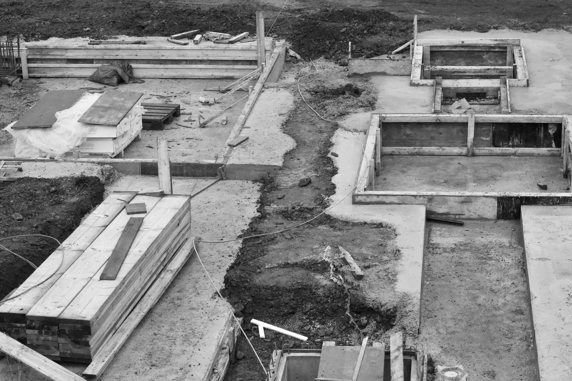 Concrete foundation forms and footings seen from above