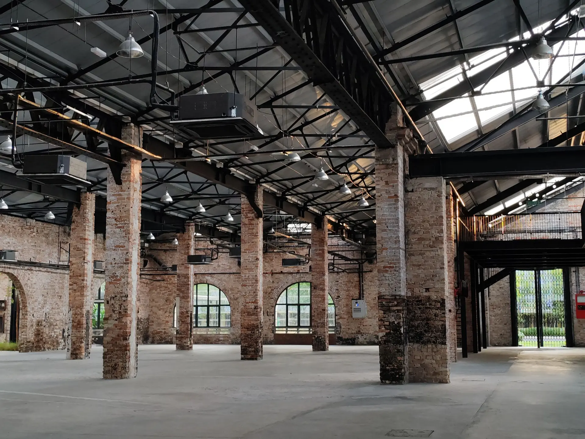 Large hall with brick piers and steel roof trusses